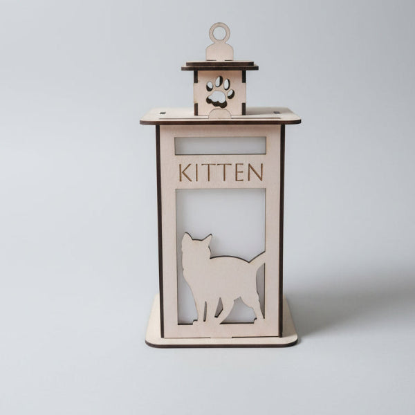 Wooden cat-shaped kitten feeder with 'KITTEN' text on a light gray background
