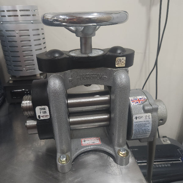 Industrial valve with visible brand logo on a metallic surface