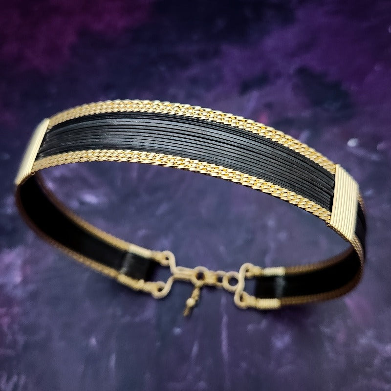 Be daring and adventurous with your style with the AMARI Collar. Crafted from a luxurious combination of blackened sterling silver and surrounded by hand-twisted accents, this collar will take you from dusk till dawn with an eye-catching elegance that will turn heads wherever you go.  Studio Navarri.