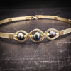 Elegantly crafted with 14k gold filled wire and large freshwater pearls of a peacock hue, this collar is a bold yet delicate accent to add femininity to any outfit. Secured with a hook and eye closure. From everything from your jeans and tee to your wedding dress!