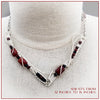 This collar is hand crafted and wrapped with strands of luscious sterling silver wire and embellished with Red Jasper and Black Onyx. Gemstones and accent beads are incorporated securely into the wire work. Flowing curves soften the hard lines of the metals and an asymmetrical flair makes this an unusual and dramatic addition to your private collection.