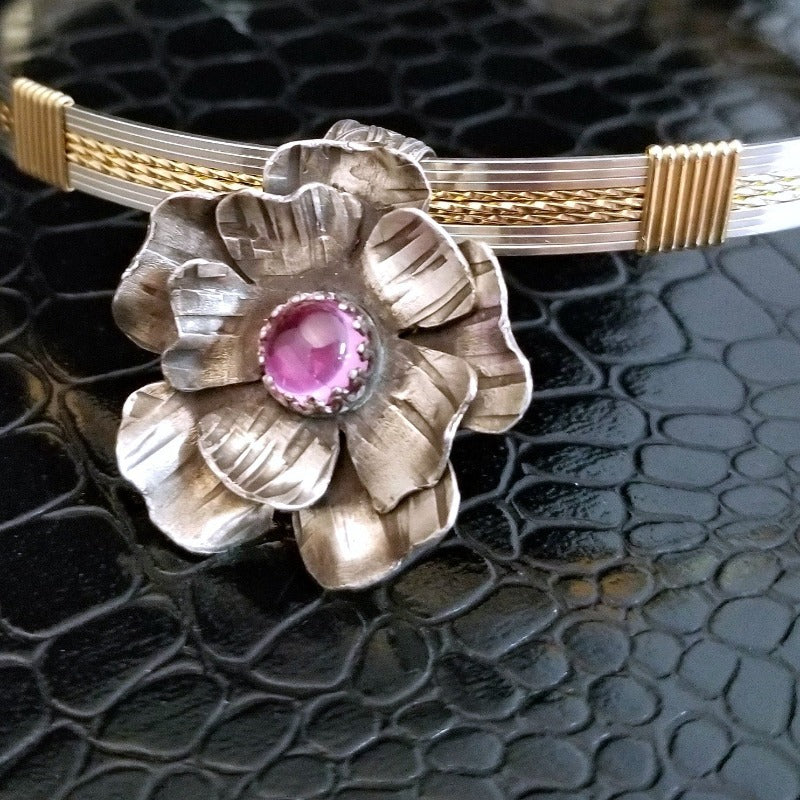 This stunning, handmade Rose of Aphrodite Pendant, crafted in sterling silver, symbolizes love and beauty, but also evokes enduring strength.