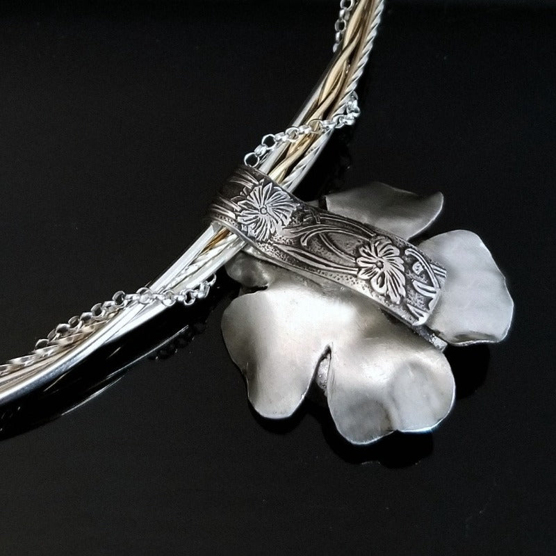 This stunning, handmade Rose of Aphrodite Pendant, crafted in sterling silver, symbolizes love and beauty, but also evokes enduring strength.