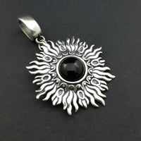 Dramatic Sunburst pendant with hand set with a  gemstone cabochon in your choice of black onyx, carnelian or moonstone. The pendant is sterling silver, the bail is silver plated. Can be worn as a pendant on a chain, or slide onto most all or our artisan collars.