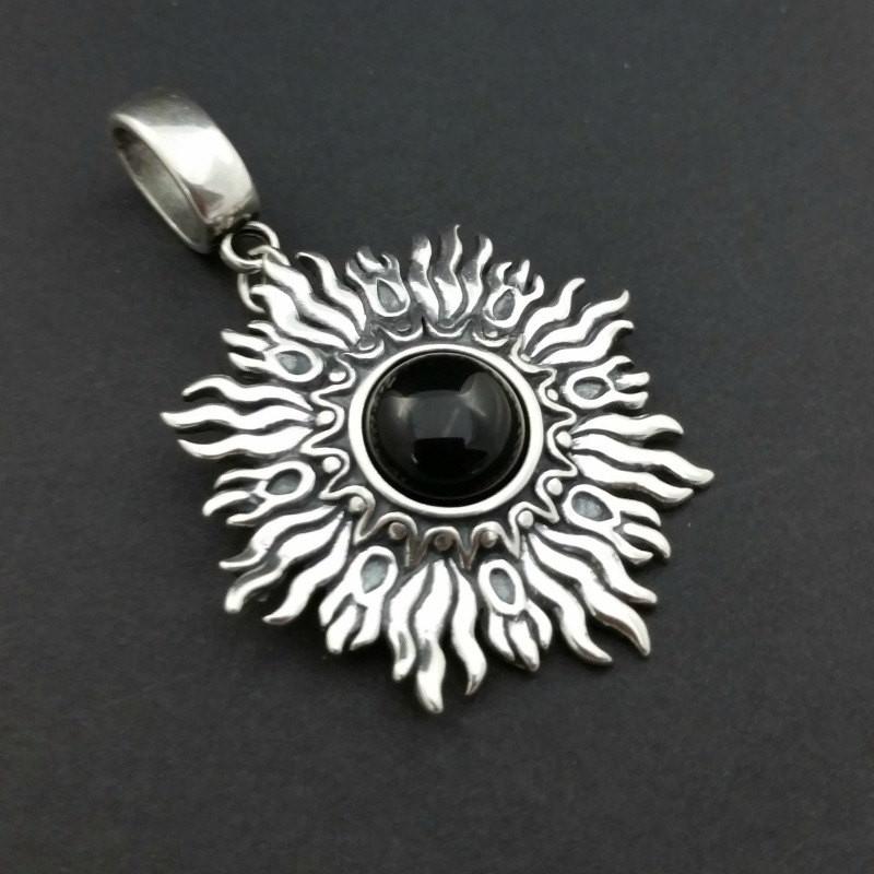 Dramatic Sunburst pendant with hand set with a  gemstone cabochon in your choice of black onyx, carnelian or moonstone. The pendant is sterling silver, the bail is silver plated. Can be worn as a pendant on a chain, or slide onto most all or our artisan collars.